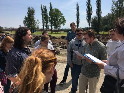 YSU students read Jewish texts by the crematorium in Auschwitz